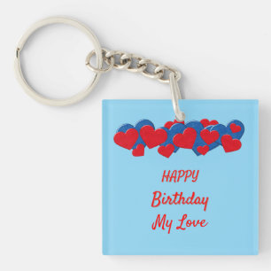 Porte-clefs Coeurs d'amour rouge et bleu sur arrière - plan bl