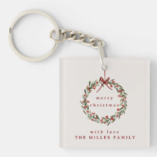 Porte-clefs Couronne feuillage de Noël avec arc rouge.