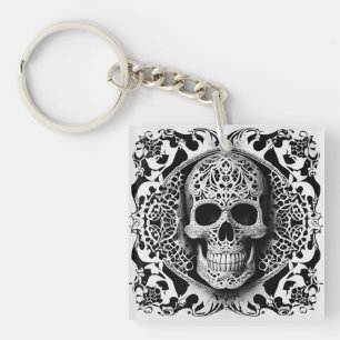 Porte-clefs Crâne de dentelle souriante noir et blanc