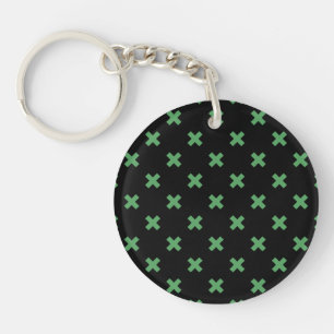 Porte-clefs Croix verte coutures sur noir