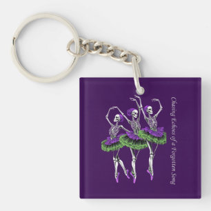 Porte-clefs Danseuse squelette violet vert Poursuivant les éch