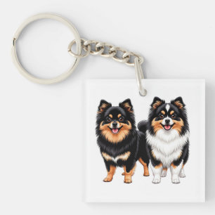 Porte-clefs Deux chiens duveteux heureux assis côte à côte