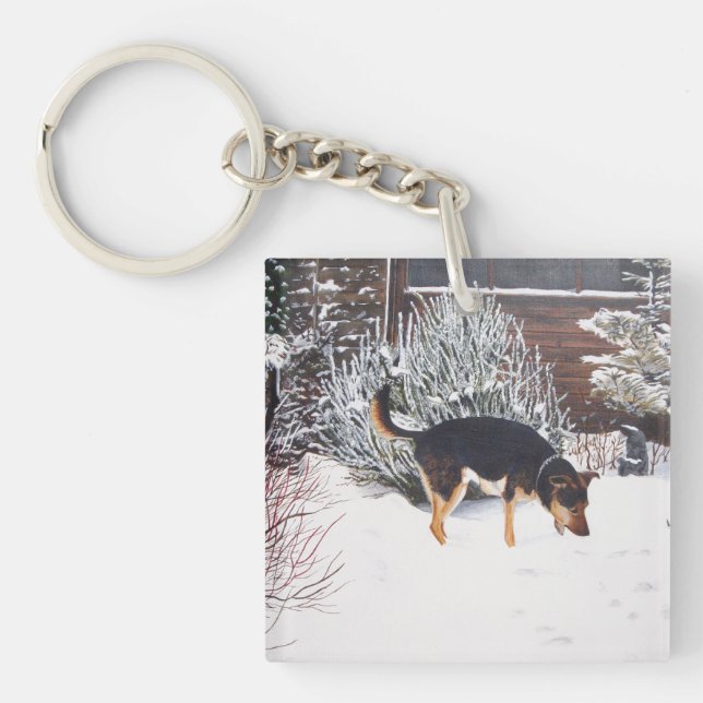 Porte-clefs Enneigement hivernal avec un mignon chien noir et  (Devant)