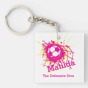 Porte-clefs Équipe de filles roses sur la défensive du footb