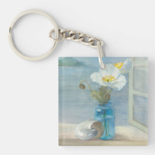 Porte-clefs Fleur blanche donnant sur la mer