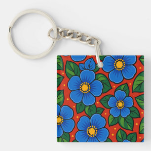 Porte-clefs Fleurs bleues et feuilles vertes sur fond rouge