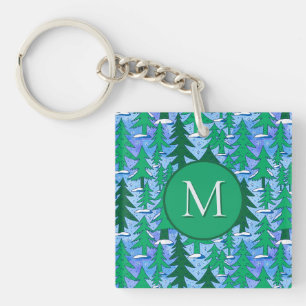Porte-clefs Forêt de sapins hivernale d'art naïf vert bleu