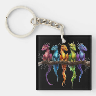 Porte-clefs Groupe Arc-en-ciel de bébés dragons sur fond noir