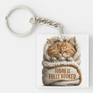 Porte-clefs Joli chaton roux endormi enveloppé dans une couver