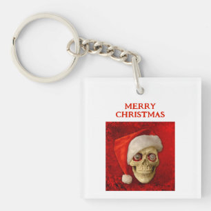 Porte-clefs Joyeux Noël. Crâne portant un chapeau de Père Noël