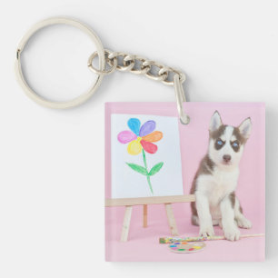 Porte-clefs Le marionnettiste Husky Peint une fleur arc-en-cie