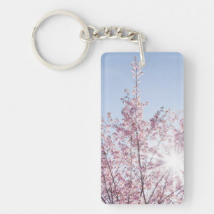 Porte-clefs les rayons du soleil traversent les fleurs roses d