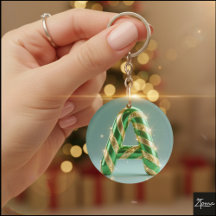 Lettre A rayée de paillettes dorées vert brillant