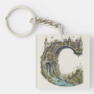 Porte-clefs Lettre Fantastique C avec des Châteaux dans le Liv
