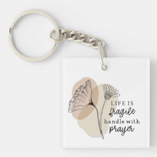 Porte-clefs Life est la main fragile de Prayer Flowers