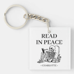 Porte-clefs Lire en paix, drôle de squelette amateur de livres