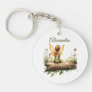 Porte-clefs Lonely Fairy assis sur un journal