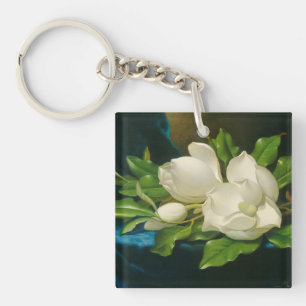 Porte-clefs Magnolias géantes sur un tissu bleu de velours,