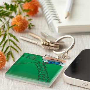 Porte-clefs Maison sur une colline verte