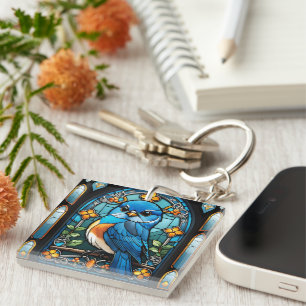 Porte-clefs Majestic Bluebird perchée sur une fenêtre en verre