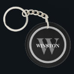 Porte-clefs Monogramme classique : Noir, Blanc et G personnali<br><div class="desc">Voici notre Porte - clé "Classic Monogram" - un mélange parfait d'élégance et de fonctionnalité. Cet accessoire sophistiqué est conçu pour ceux qui apprécient un style classique avec une touche personnelle. L'élégante palette de couleurs noir, blanc et gris dégage une élégance intemporelle qui vient compléter n'importe quel ensemble de touches....</div>