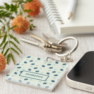 Porte-clefs Monstère tropicale monogramme feuille sur bleu