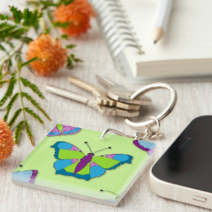 Porte-clefs Motif papillon patchwork sur fond vert
