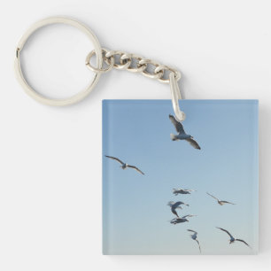 Porte-clefs Mouettes volant au-dessus des vagues de l'océan Oi