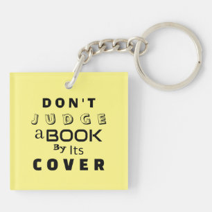 Porte-clefs "Ne juge pas un livre par sa couverture" Jaune cla