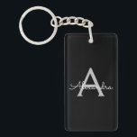 Porte-clefs Noir Argent moderne Script Girl Monogramme Nom<br><div class="desc">Noir et Argent Simple Script Monogramme Nom Porte - clé. Cela rend le cadeau parfait pour 16 ans,  mariage,  douche nuptiale,  anniversaire,  baby shower ou bachelorette pour quelqu'un qui aime le luxe glam et les styles chic.</div>