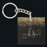 Porte-clefs Nom du monogramme de la Parties scintillant d'or<br><div class="desc">Glam Gold Parties scintillant Élégant Monogram Nom Porte - clé Personnalisez facilement ce design porte - clé chic branché avec élégante parties scintillant dorée sur un arrière - plan noir. Le design comprend votre monogramme manuscrit avec de jolis tourbillons et nom.</div>