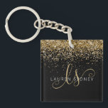 Porte-clefs Nom du monogramme de la Parties scintillant d'or<br><div class="desc">Glam Gold Parties scintillant Élégant Monogram Nom Porte - clé Personnalisez facilement ce design porte - clé chic branché avec élégante parties scintillant dorée sur un arrière - plan noir. Le design comprend votre monogramme manuscrit avec de jolis tourbillons et nom.</div>