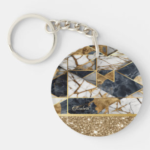 Porte-clefs Pailleté doré élégant sur fond de marbre noir.