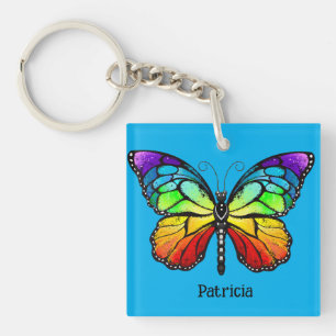 Porte-clefs Papillon coloré moderne sur Arrière - plan bleu