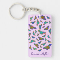 Papillons colorés sur porte - clé rose bébé