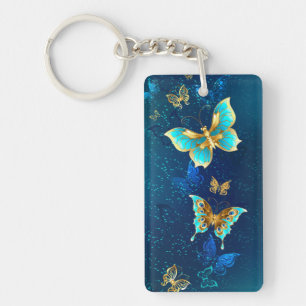 Porte-clefs Papillons dorés sur fond bleu