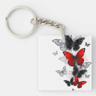 Porte-clefs Papillons noirs et rouges volants