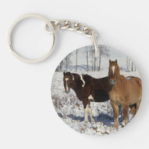 Porte-clefs Peignez les chevaux dans la neige