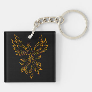 Porte-clefs Phoenix de cuivre doré se lève sur fond noir 
