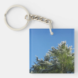 Porte-clefs Pin à pointes de neige sur le ciel bleu