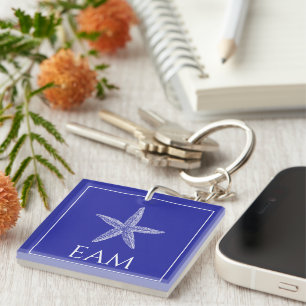 Porte-clefs Poisson étoile blanche côtière sur Monogramme bleu