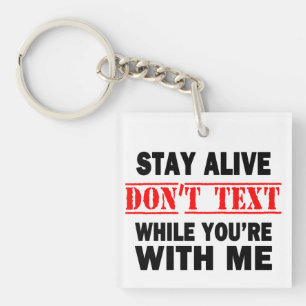 Porte-clefs Restez en vie. N'envoyez pas de textos pendant que