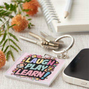 Porte-clefs Rire, Jouer, Apprendre le rose