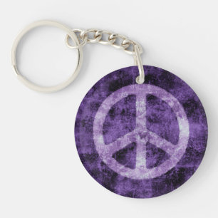 Porte-clefs Signe de paix pourpre affligé