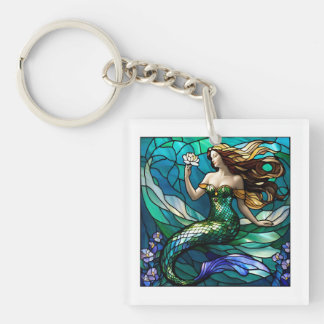 Porte-clefs Sirène en verre tendu admirant une fleur