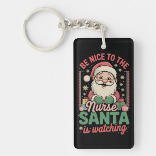 Porte-clefs Soyez gentil avec l'infirmière, le Père Noël regar