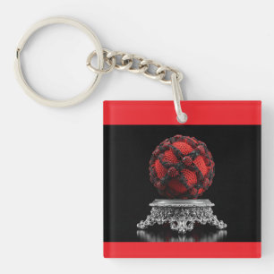 Porte-clefs Sphère de Mandelbrot rouge et noir sur piédestal a