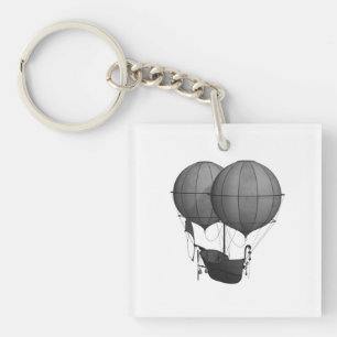 Porte-clefs Steampunk Design Machine volante noire et blanche