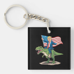 Porte-clefs Trump à cheval sur un dinosaure T Rex drapeau amér