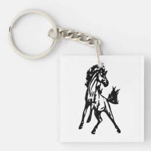 Porte-clefs Un cheval qui saute frénétiquement dans la nature
